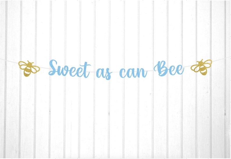 May include: A blue and gold glitter banner with the text "Sweet as can Bee" and two gold glitter bee cutouts.