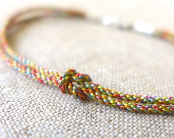 Slender Silk Rainbow Infinity Knot Rope Bracelet with Sterling Silver End Caps and Clasp