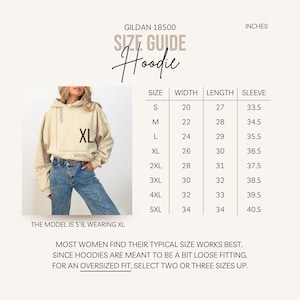 May include: A beige hoodie with a size guide chart. The chart lists sizes S to 5XL, with measurements in inches for width, length, and sleeve length. The model is 5'8" and wearing an XL. The text says "SIZE GUIDE Hoodie".