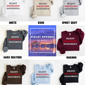 May include: A collection of long-sleeved sweatshirts in various colors, including white, sand, sport grey, dark heather, maroon, dark chocolate, light blue, and black. Each sweatshirt features the text "SILENT DISCIPLINED DANGEROUS."