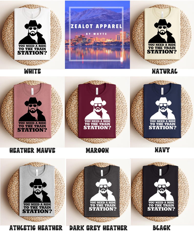 K&ouml;nnte beinhalten: Eine Auswahl an T-Shirts in verschiedenen Farben, jeweils mit einer Grafik eines Mannes mit Cowboyhut und Sonnenbrille sowie dem Text "YOU NEED A RIDE TO THE TRAIN STATION?". Farben sind Wei&szlig;, Natur, Heather Mauve, Maroon, Navy, Athletic Heather, Dark Grey Heather und Schwarz.