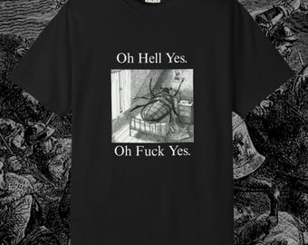 May include: Black t-shirt with a monochrome illustration of a beetle on a bed, accompanied by the text "Oh Hell Yes." and "Oh Fuck Yes." The shirt has a crew neck and short sleeves. The background has a medieval theme.