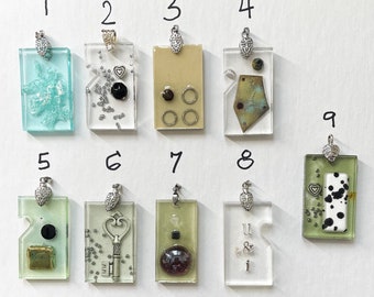 Hand Made Resin Pendants some with Swarowski crystals, Hand made Ceramic Elements, Glass beads and Steampunk silver details