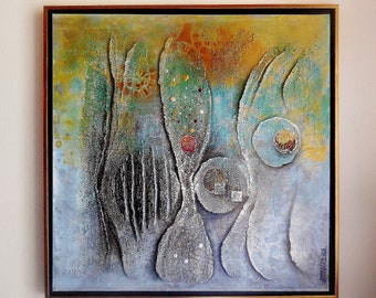 May include: Abstract painting with a textured, layered surface. The painting features a variety of shapes and colors, including silver, blue, green, and yellow. The painting is framed in a gold frame.