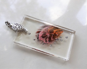 Hand-made pendant with clear epoxy resin and real feather with a silver hook, unique gift idea for any occasion