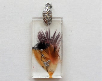 Hand-made pendant with clear epoxy resin and real feather with a silver hook, unique gift idea for any occasion