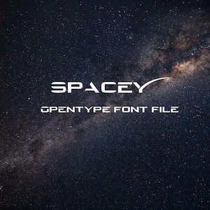 May include: A white font design with the word "SPACEY" in a futuristic style with a small rocket ship symbol. The text "OPENTYPE FONT FILE" is below the word "SPACEY". The background is a dark blue with white stars.