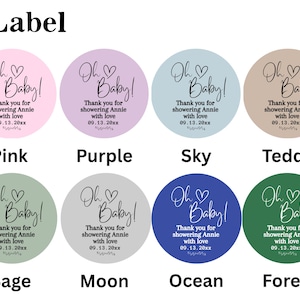 May include: A collection of eight circular labels in various colors, each featuring the text "Oh Baby!" in elegant script. The labels also include the message "Thank you for showering Annie with love 09.13.20xx."