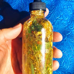 Money Ritual Oil, spell Prosperity Conjure Oil with Herbs, Gems, Gold Leaf 4oz Bottle Wealth Attraction Hoodoo Oil handmade money drawing ritual oil, afro atlantic prosperity conjure blend, wealth attraction feng shui rootwork oil, handcrafted spell oil with herbs and stones, 24k gold leaf magical abundance oil, magick intention oil for money success financial Collar de Odi bara Odu Obara Di Black and Red seed necklace odibara oddi obaradi eleke dilogun kacha osun odu ifa Elegua iwere iyeye