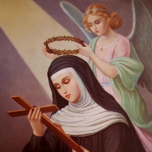 May include: A painting of a woman in a black habit holding a wooden cross. An angel with wings is placing a crown of thorns on her head.