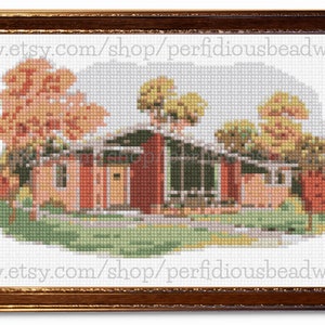 May include: Cross-stitch artwork of a house with a brown frame. The house is a mid-century modern style, with a red brick exterior and a green lawn. Trees with orange and yellow leaves surround the house. The text "www.etsy.com/shop/perfidiousbeadworks" is visible.