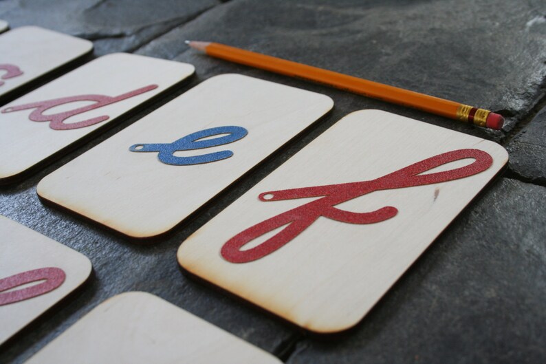 lowercase cursive sandpaper letters on 3x5 inch birch wood