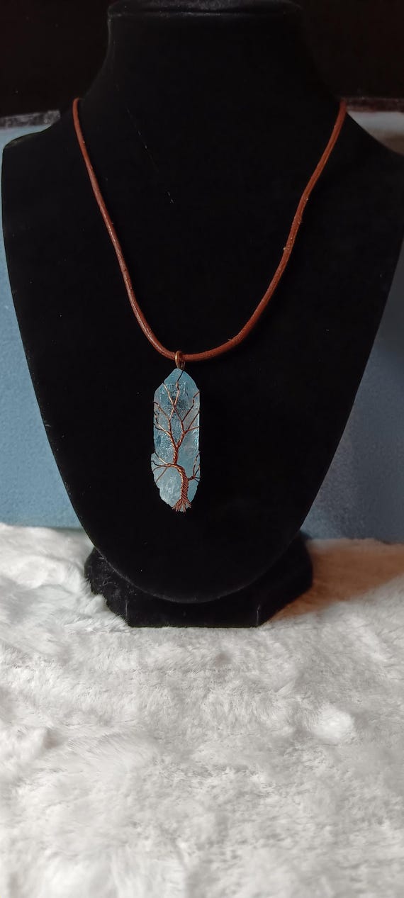 Stone amulet necklace, ice blue amulet, bronze color leather cord, bronze wire wrapped amulet, pendant necklace.
