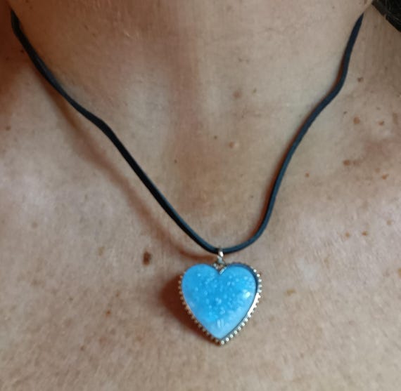Blue epoxy resin heart pendant, pendant with flowers, black suede cord.