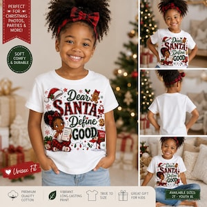 May include: A white short-sleeve t-shirt featuring a graphic of a child holding a list, a gingerbread man, a candy cane, and a mailbox. The text reads Dear SANTA Define GOOD. The shirt is paired with a red and black plaid headband.