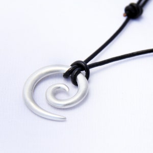 Tribal Koru in  brushed silver