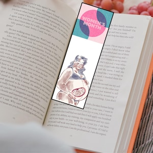 May include: A bookmark with a pink circle that says "Women's Month" in white text. The bookmark features a watercolor illustration of a pregnant woman holding her belly with a small baby inside.