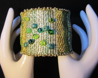 Sold!!!!!!!!Cuff woven in a loom with beads and fibers, this one is called SUMMER GRASS.   OOAK!