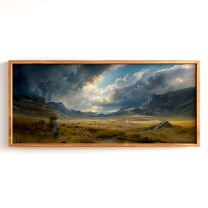 May include: A landscape painting in a wooden frame shows a valley under a dramatic sky. The artwork features a golden field, dark mountains, and a stormy sky with sunlight. The wooden frame adds a rustic touch to the artwork.