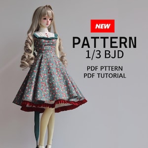 May include: A ball-jointed doll wearing a teal dress with a small red and white floral print, a white high-neck collar, and a dark red ruffled hem. The text reads NEW PATTERN 1/3 BJD PDF PTTERN PDF TUTORIAL. The doll has long wavy blonde hair.