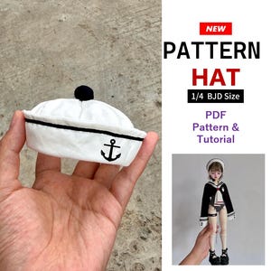 May include: A white sailor hat with a black trim, a black pom-pom on top, and a black anchor graphic on the front. The text reads NEW PATTERN HAT 1/4 BJD Size PDF Pattern & Tutorial. A doll wearing a matching sailor outfit is also shown.