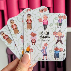 May include: Sticker sheets with illustrations of elderly women, numbers, and floral patterns. The text "Only Grans" and "Save £15" is displayed. The stickers are held in a hand.