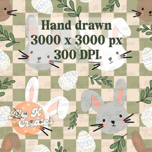 May include: A seamless pattern featuring grey and white bunnies with long ears, green leaves, and pastel blue and white Easter eggs on a checkered background of green and beige squares. The text "Hand drawn 3000 x 3000 px 300 DPI." is in the centre of the image.