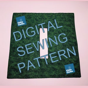 May include: Green fabric square with the text "DIGITAL SEWING PATTERN" in blue letters. The text is partially obscured by a white rectangle. The fabric has a textured surface. The text "Chiro Cloths" appears in the top left and bottom right corners of the square.