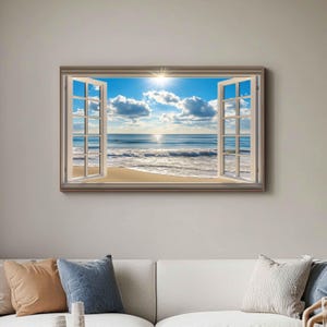 Puede incluir: Una obra de arte enmarcada que representa una escena de playa vista a través de una ventana abierta. La obra de arte muestra un cielo azul brillante con nubes blancas, el sol y el océano. El marco de la ventana es blanco y el marco alrededor de la obra es gris claro.