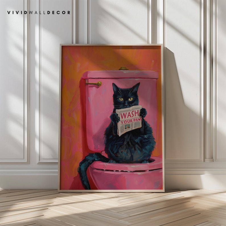 May include: A black cat sits on a pink toilet bowl, holding a newspaper that reads "Wash Your Paw!" The cat is looking at the camera. The background is a bright orange color.