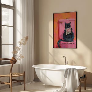 May include: A black cat sitting on a pink toilet with a newspaper that says "Wash Your Paws" in a bathroom setting with a white bathtub and a brown chair.