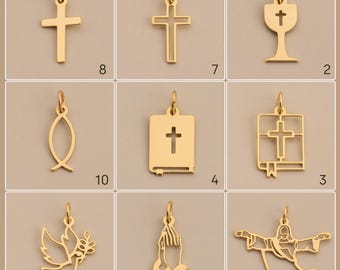 May include: A collection of gold-colored religious pendants, including crosses, a chalice, a fish symbol, a Bible with a cross, a dove with an olive branch, praying hands, and a depiction of Jesus.