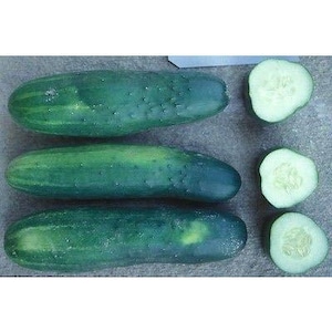 May include: Three green cucumbers, two whole and one sliced in half, on a gray surface.