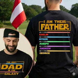 May include: Black t-shirt with the text "I AM THEIR FATHER" and names below, each with a coloured lightsaber graphic. A second image shows a man wearing a black cap and a shirt that says "THE BEST DAD IN THE GALAXY".