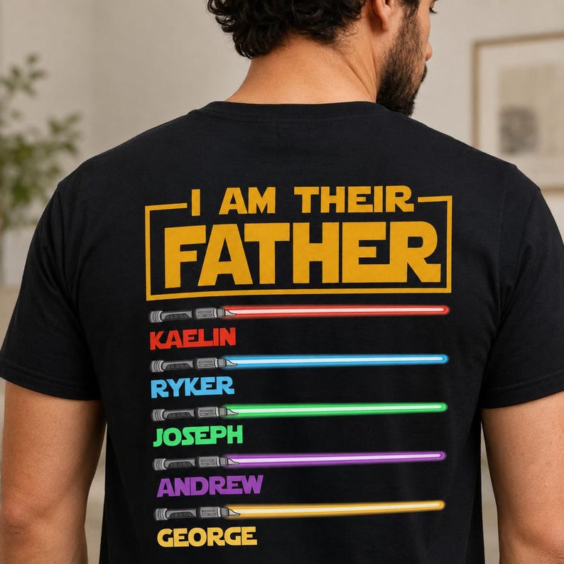 May include: Black t-shirt featuring the text "I AM THEIR FATHER" in yellow. Below the text are six coloured lightsabers with names: Kaelin, Ryker, Joseph, Andrew, and George. The lightsabers are red, blue, green, purple, and yellow.