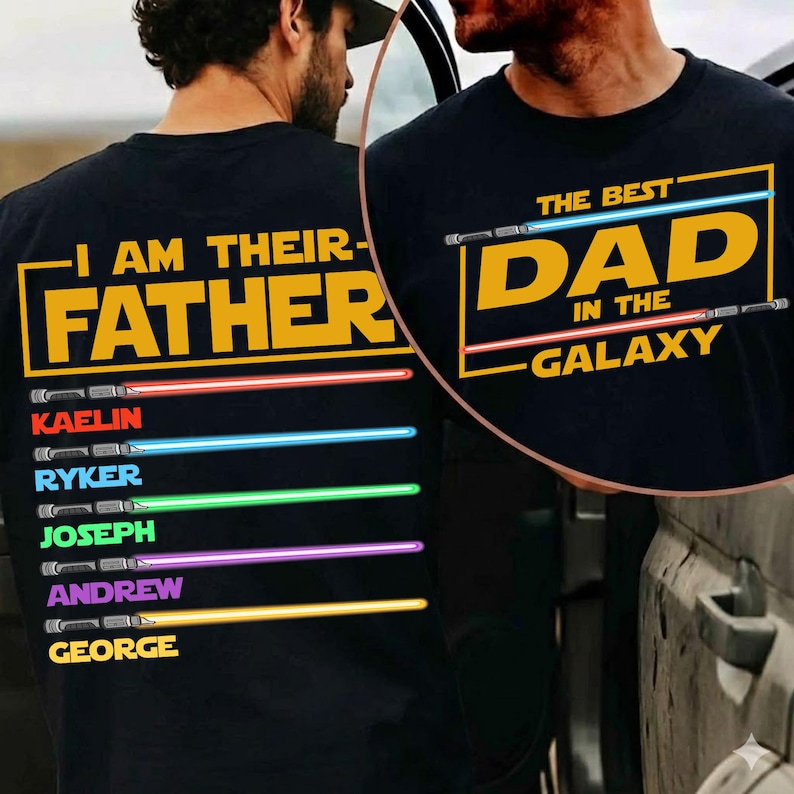 May include: Black t-shirt featuring the text "I AM THEIR FATHER" in yellow, with names and coloured lightsabers below. The front of the shirt says "THE BEST DAD IN THE GALAXY" in yellow with lightsabers.