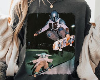 Mando and Baby Yoda Skateboarding Hip Hop Comfort Color Shirt, Disney Trip Hip Hop Wear, Star Wars Meme, Disneyland Trip Shirt 2026