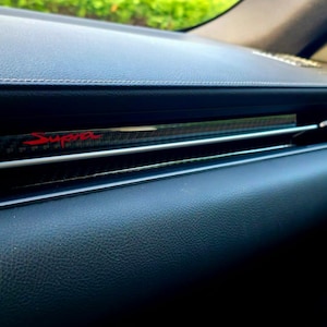 Toyota Supra || Cache-robinet || Aspect carbone