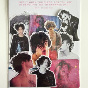 May include: A sticker pack featuring multiple images of a person with curly dark hair. The stickers are in various poses and styles, some in black and white, others in color. Text at the top reads "I LIKE IT WHEN YOU SLEEP, FOR YOU ARE SO BEAUTIFUL YET SO UNAWARE OF IT".