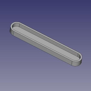 May include: A grey plastic rectangular tray with rounded edges and a shallow, rectangular depression in the centre.