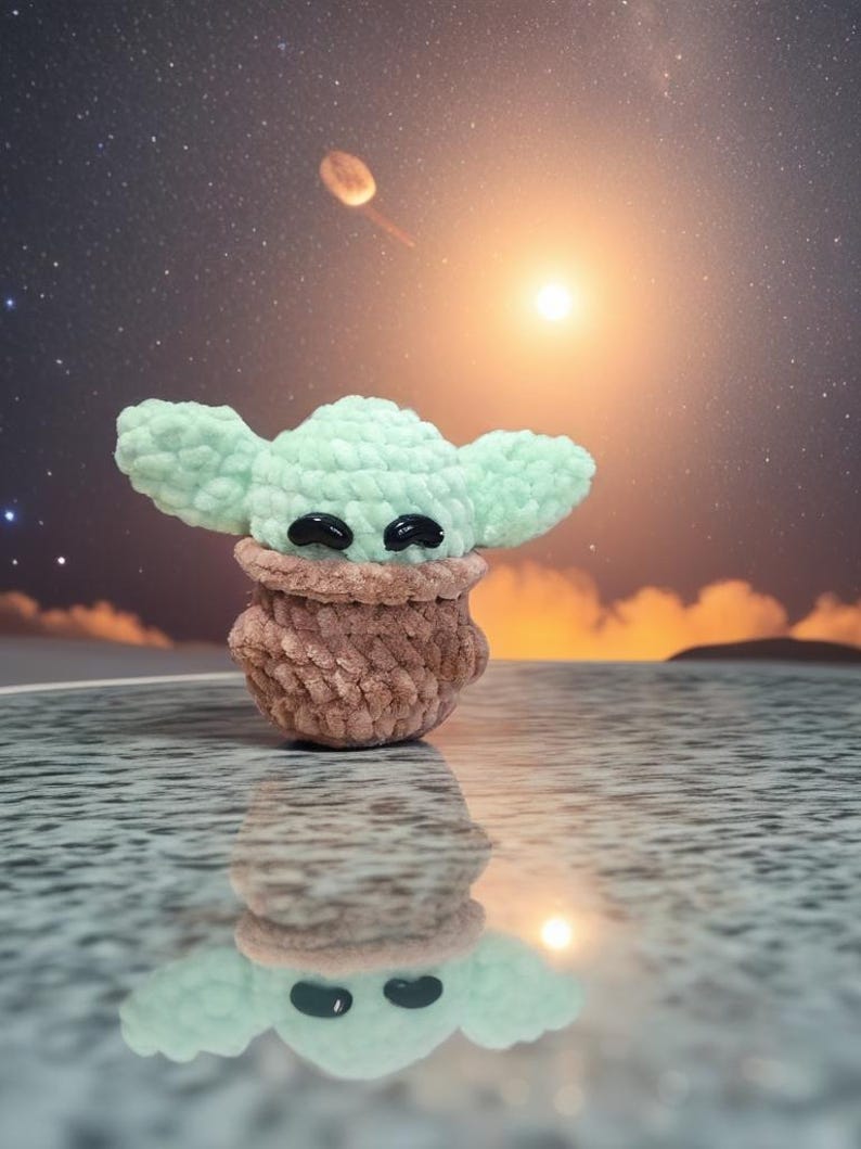 May include: A handmade crochet figure of a character with large ears and black eyes. The figure is light green and brown, with a textured appearance. The background features a starry sky and a bright light source, creating a whimsical scene.