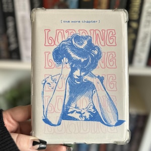 May include: A white phone case with a blue and pink design. The design features a woman with a blue hairdo and the word "Loading" repeated in pink letters.
