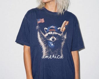 Patriotic Raccoon holding flag and hotdog T-Shirt | America script