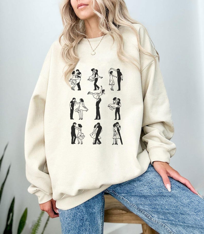 Puede incluir: Una sudadera de color crema con un estampado gr&aacute;fico de nueve siluetas negras de parejas bailando.