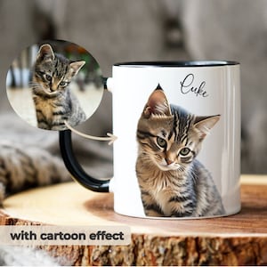 May include: White ceramic mug with a black rim and handle. A cartoon image of a tabby cat is printed on the mug. The cat's name, "Luke", is written in cursive on the mug.
