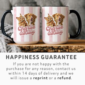 May include: Two white ceramic mugs with black handles and a pink striped design. Each mug features a cat and dog image with the text "Charlie & Lilly" in pink. The mugs are on a wooden surface.