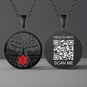 May include: Black metal necklace with a round pendant featuring a tree of life design with a red medical symbol. The back of the pendant has a QR code with the text "HEALTH INFO SCAN ME".