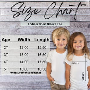 two little girls standing next to each other in front of a wooden wall