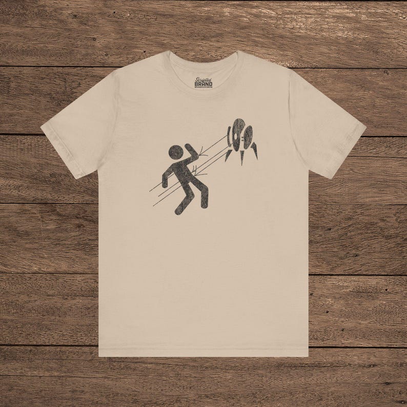 Tan Aperture Science Turret warning icon t-shirt on Bella+Canvas 3001, vintage distressed print, Portal and Portal 2 fan tee.