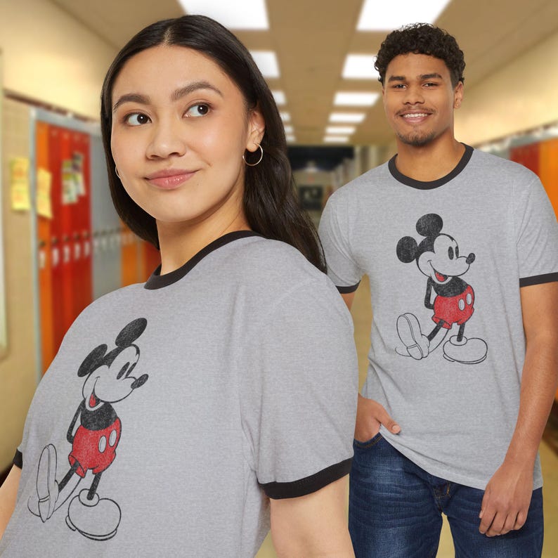 Two people wearing Heather gray and black ringer tee with distressed Mickey Mouse graphic, Outsiders Two-Bit inspired, sleeves can be cut off